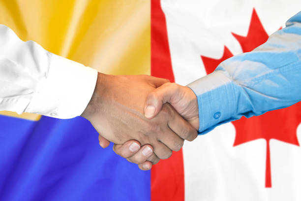 istock handshake on Canada and Ukraine flag background. 1148514106