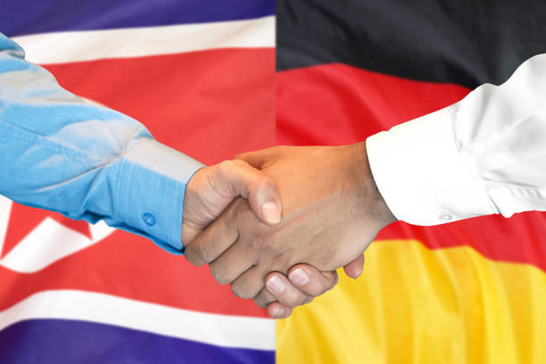 istock handshake on North Korea and Germany flag background. 1148514146