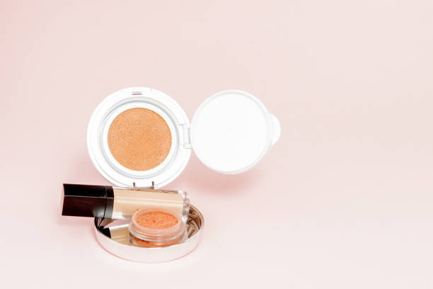 istock Make up products spilling on to a bright pink background with copy space 1148515900