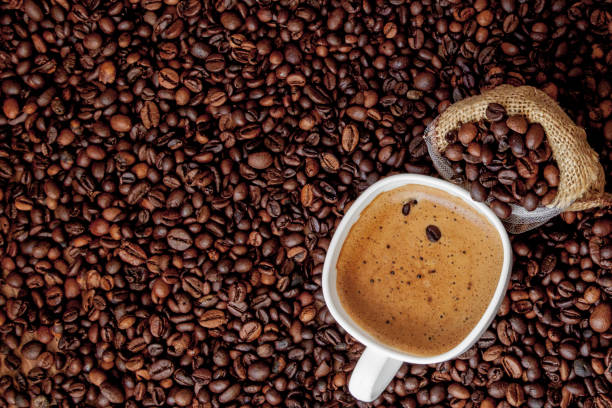 istock Coffee cup with coffee bag on wooden table. View from top 1148517785
