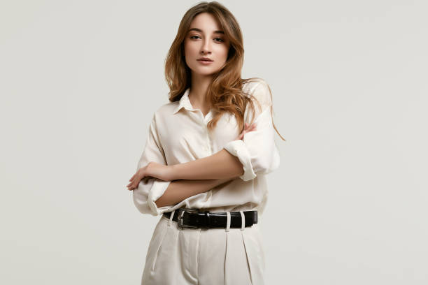 istock Gorgeous female brunette model in white clothes 1148523272