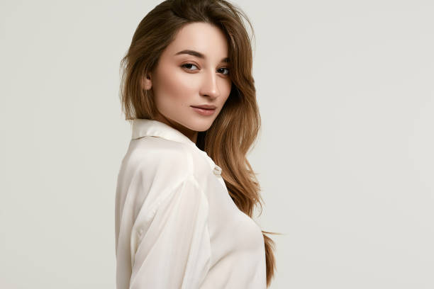 istock Gorgeous female brunette model in white clothes 1148523279