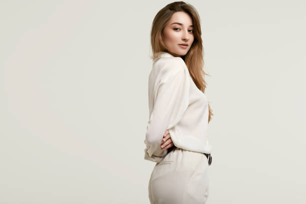 istock Gorgeous female brunette model in white clothes 1148523285
