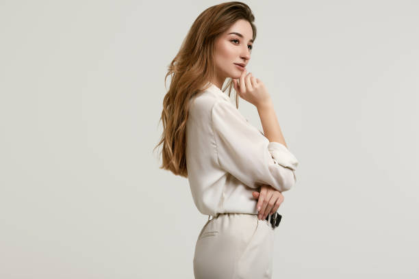 istock Gorgeous female brunette model in white clothes 1148523289
