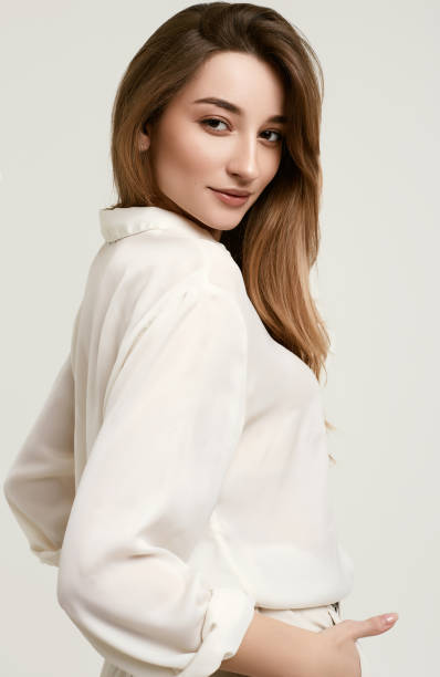 istock Gorgeous female brunette model in white clothes 1148523294