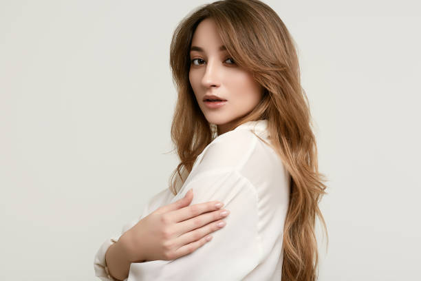 istock Gorgeous female brunette model in white clothes 1148523316
