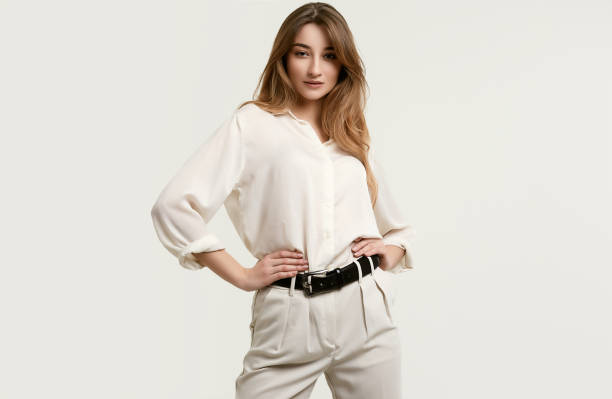 istock Gorgeous female brunette model in white clothes 1148523318
