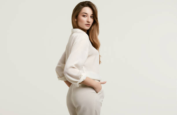 istock Gorgeous female brunette model in white clothes 1148523329