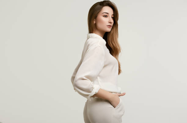 istock Gorgeous female brunette model in white clothes 1148523369
