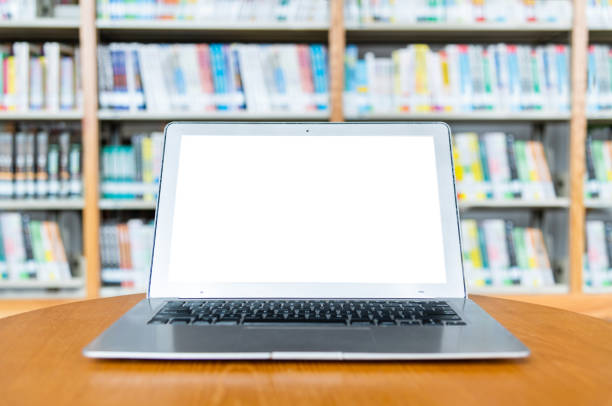 istock Blank laptop on the table of library 1148532447