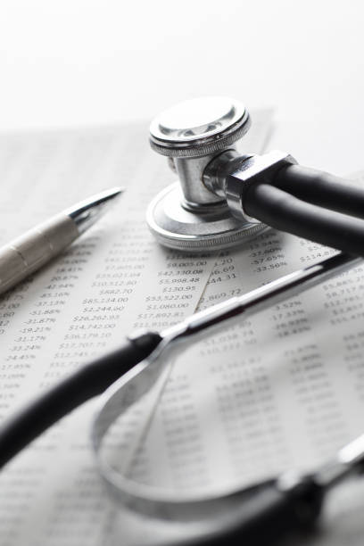 istock Red doctor stethoscope isolated on white paper spreadsheets 1148533517