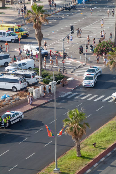 Gay pride day in Tel Aviv, where police have closed down streets and people are wandering near the beach. Israel 2017 Gay pride day in Tel Aviv, where police have closed down streets and people are wandering near the beach. Israel 2017 ambulance in israel stock pictures, royalty-free photos & images