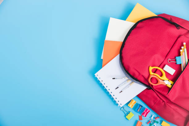 bag backpack for education children Top view Red bag backpack for education children on blue background back to school concept rucksack stock pictures, royalty-free photos & images