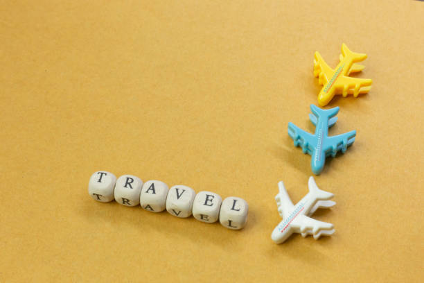 istock travel  wood cube close up image  for travel content. 1148540044