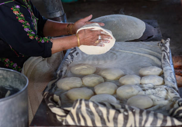 istock Muslim woman making food. 1148543127