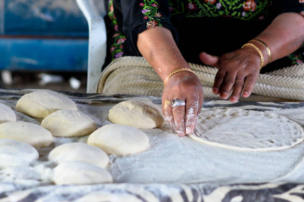 istock Muslim woman making food. 1148543130