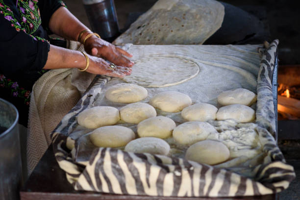 istock Muslim woman making food. 1148543133