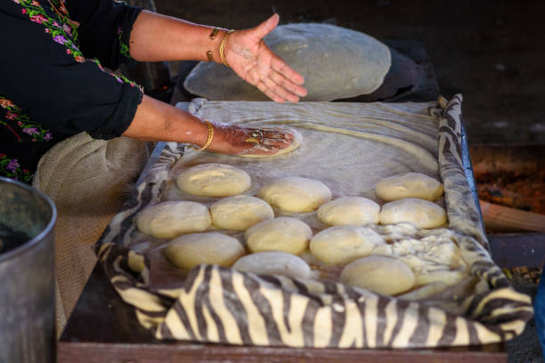 istock Muslim woman making food. 1148543136