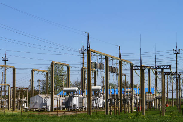 istock High-voltage power lines and voltage transformer blocks on a blue sky. Electric power substation 1148543825