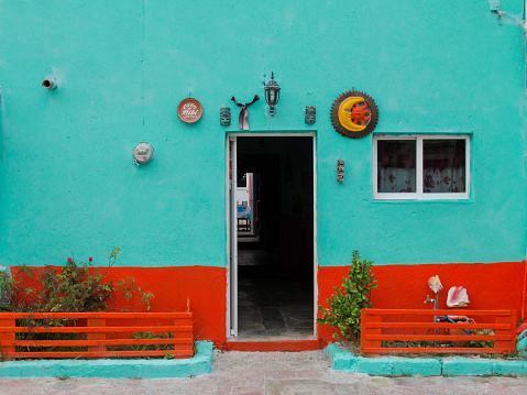 Colorful homes painted bright, tropical colors line the streets of the Caribbean island of Isla Mujeres, Mexico.