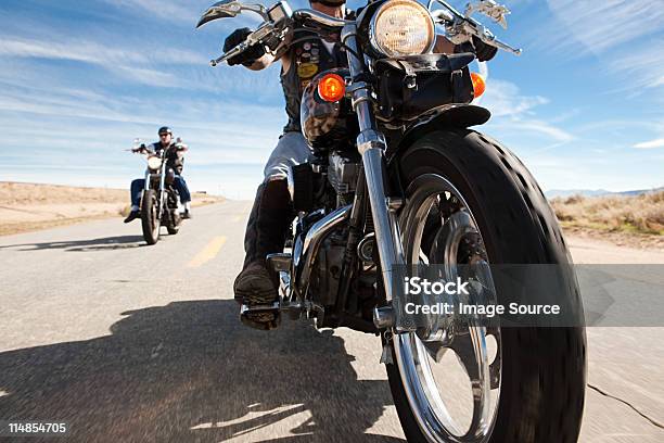 Two Men Riding Motorcycles Along Road Stock Photo - Download Image Now - Motorcycle, Riding, USA