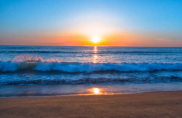 istock Sunset on the Beach, Beautiful Colorful Sky, and Ocean Waves 1148548480
