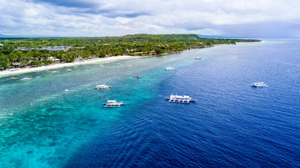Panorama Aerial drone picture of the white sand Alona Beach in Panglao, Bohol, Philippines Shot with the DJI Mavic Pro bohol photos stock pictures, royalty-free photos & images