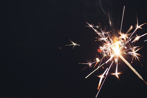 Sparkler fireworks on black background. Special occasion, celebration, birthday, Christmas concepts.