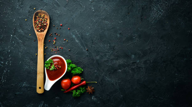 istock Ketchup sauce. Tomatoes, spices and herbs. Top view. Free space for your text. 1148551428