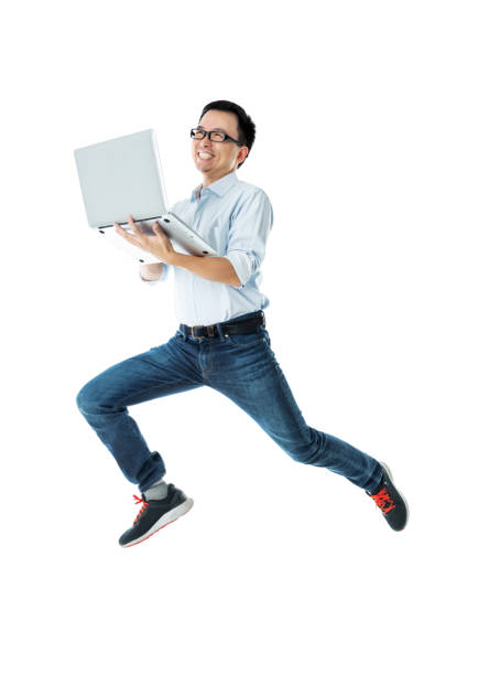 istock Businessman jumping with laptop on white background 1148551482