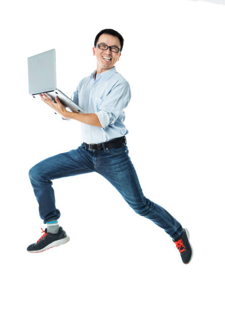 istock Businessman jumping with laptop on white background 1148551491