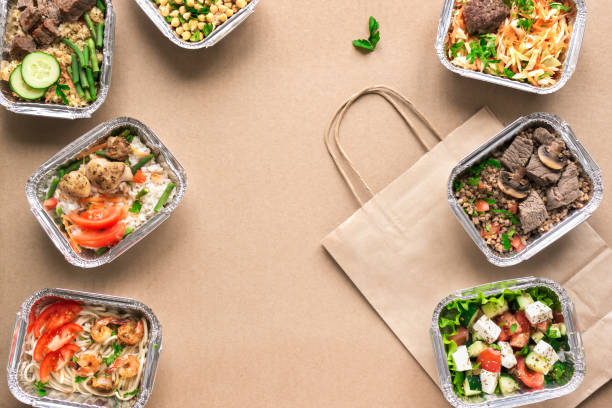 Delivery Healthy Food Healthy food delivery. Take away of organic daily meal, copy space. Clean eating concept, healthy food, fitness nutrition take away in foil boxes, top view, flat lay. bag lunch stock pictures, royalty-free photos & images