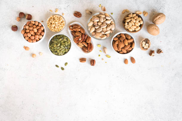 nuts sortiment - pine nut nut seed vegan food stock-fotos und bilder