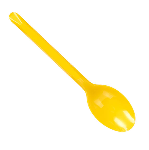 istock Yellow plastic spoon, disposable utensil. Isolated on white 1148557262
