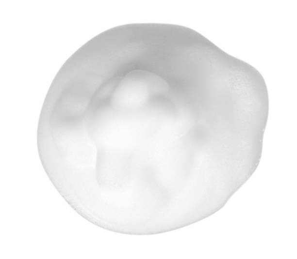 istock White foam bubbles, beauty smooth mousse, close up photo. 1148557286