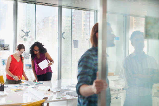 istock Women working together on table in design office 1148558905