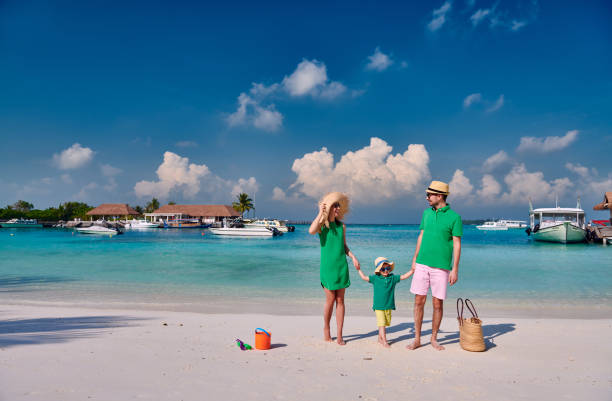 istock Family with three year old boy on beach 1148561436