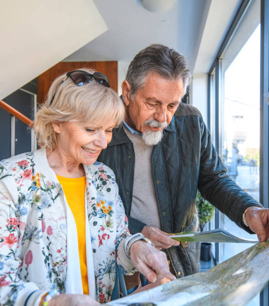 istock Senior Couple Planning Activities on Vacation 1148563476