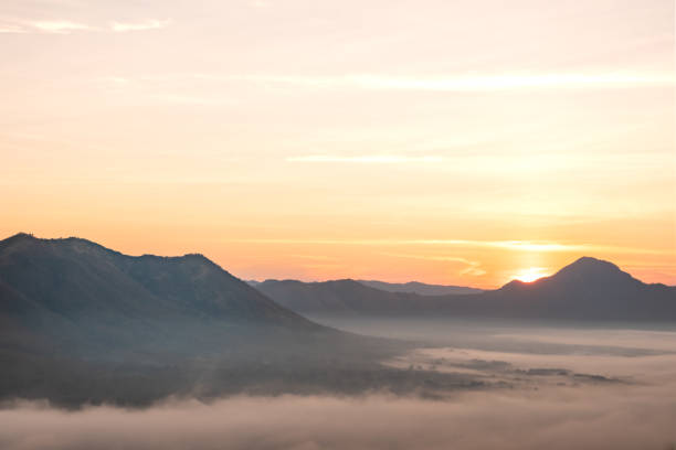 istock Morning atmosphere at Mueang Loei Chiangkhan with warm tone and mountain range covered with fog 1148564586