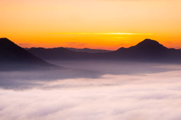 istock Morning atmosphere at Mueang Loei Chiangkhan with warm tone and mountain range covered with fog 1148564768