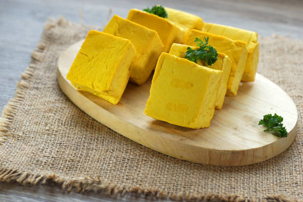 istock yellow tofu on cutting board 1148565070