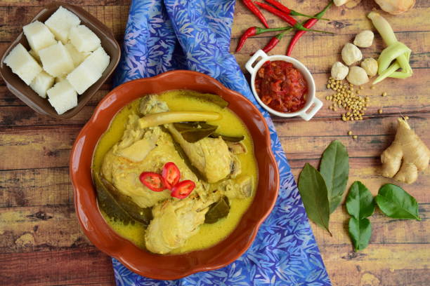 istock Opor ayam, chicken cooked in coconut milk from Central Java, Indonesia. Served with lontong and sambal. Popular dish for lebaran or Eid al-Fitr 1148565845