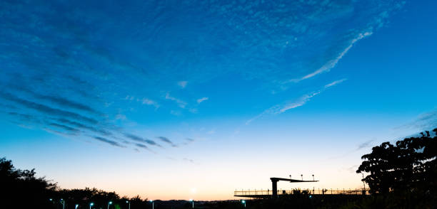Radio antenna with blue sky at airport.