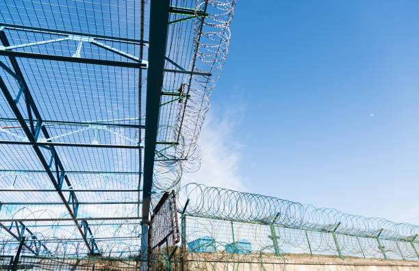 istock Metal wall with barbed wire 1148570718
