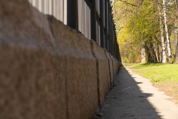 istock the path along the cast-iron fence on a granite stand 1148572995