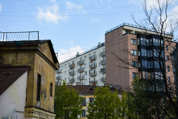 istock Modern houses rise above old buildings 1148573227