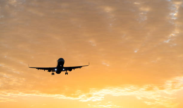 istock An airplane flying at sunset 1148575293