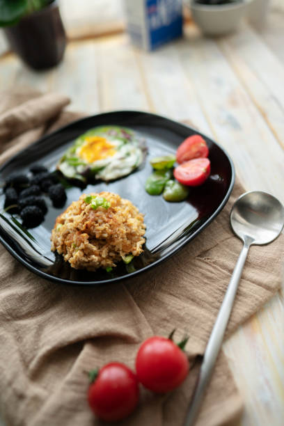 homemade healthy breakfast:fried rice, egg and fruits