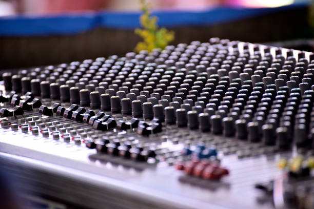 Close-up of sound mixer in a studio mixing sound.