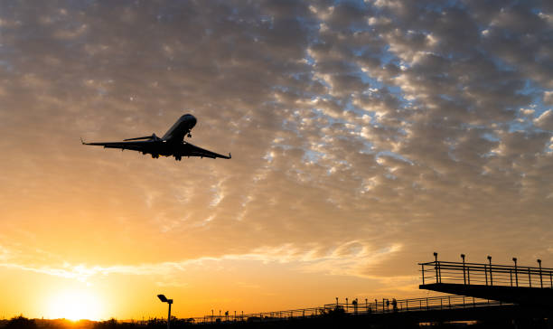 istock Airplane flying over radio antenna 1148576540